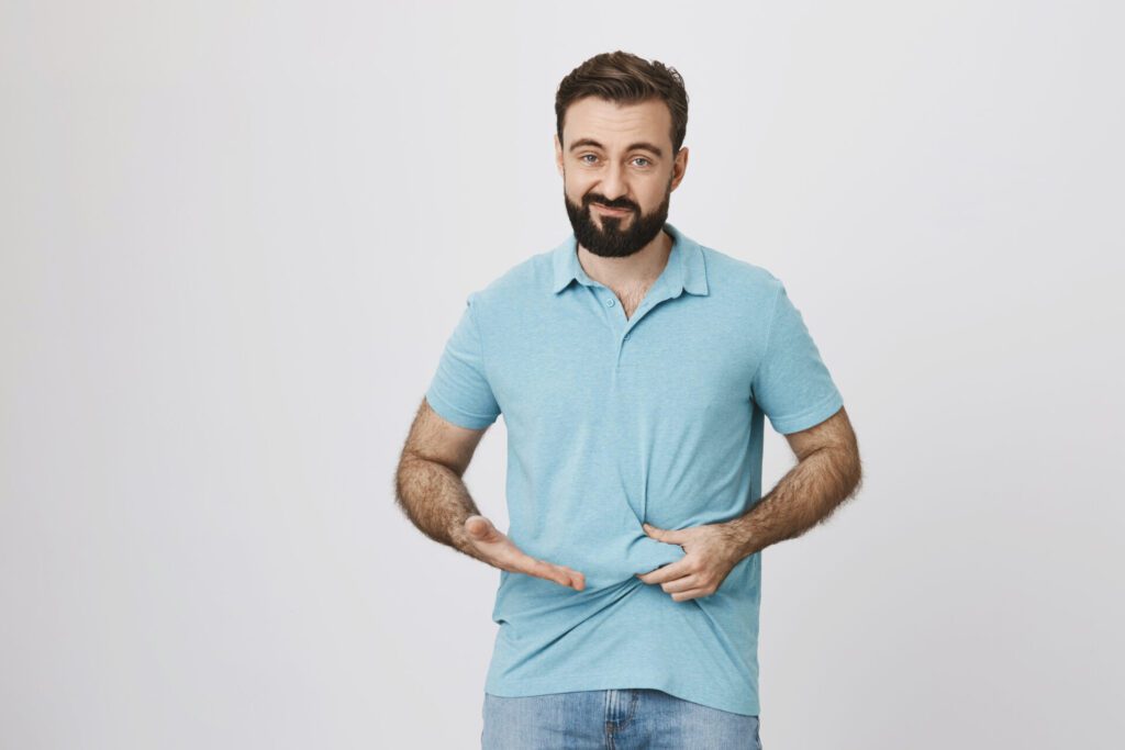 disappointed guy need lose weight showing fat belly