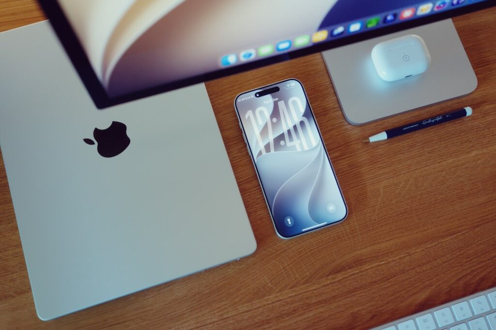 MacBooster 8 for Mac: Features, Fit, and a Careful Buying Checklist 2 MacBook Pro on a wooden desk, illustrating a Mac maintenance buyer guide.