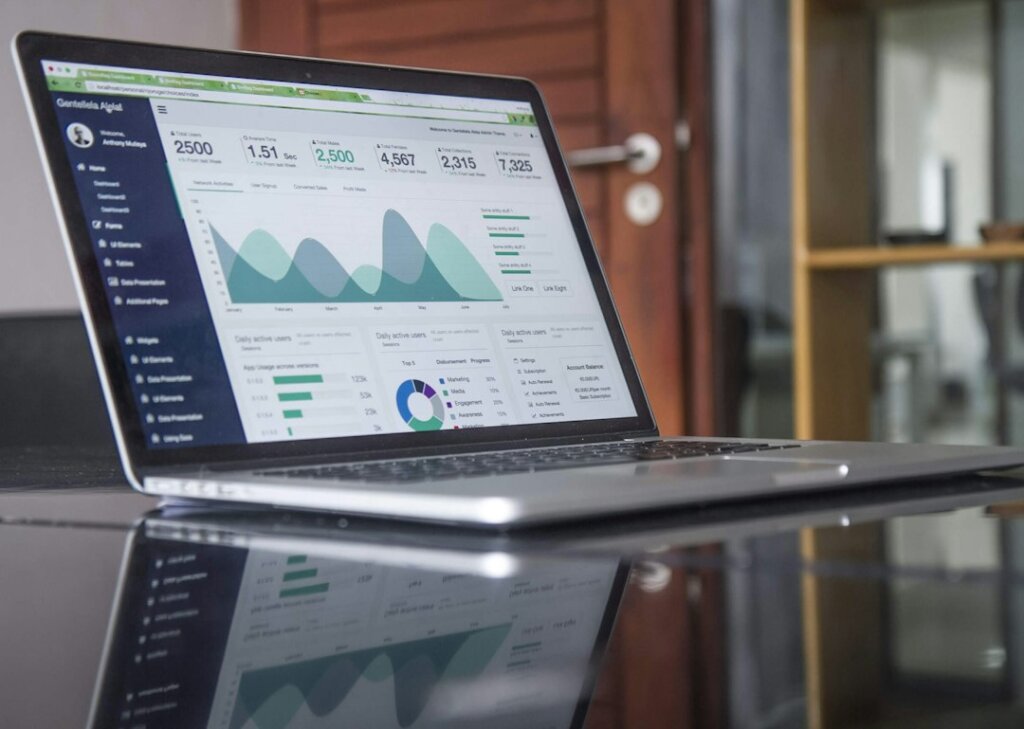 Email marketing analytics on a laptop; featured image for the Moosend newsletter migration checklist